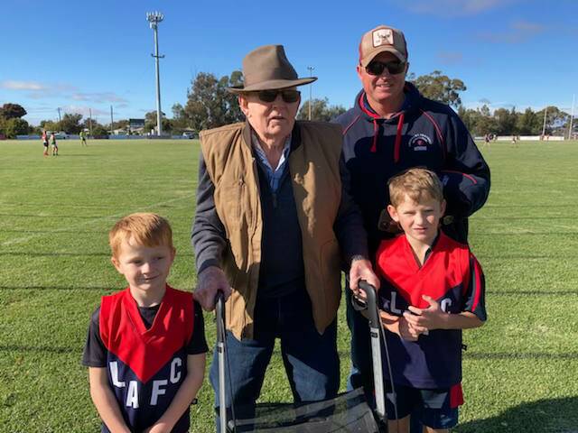 FAMILY AFFAIR: Gerry Lane with his son Matt and grandchildren, Will, six, and Tommy, eight, at Lockhart Sportsground this year.