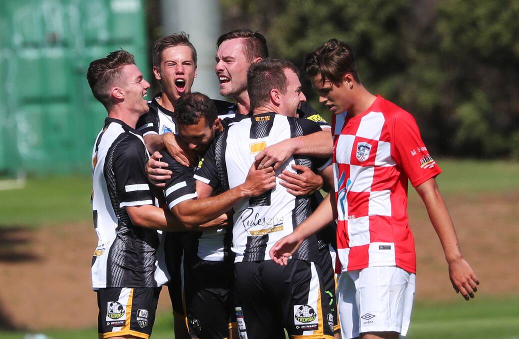 HAPPY DAYS: Wagga City Wanderers celebrate a goal against O'Connor Knights at Gissing Oval on Saturday. Picture: Emma Hillier
