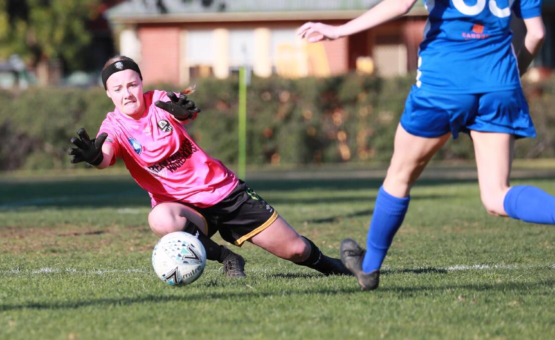 ON THE MOVE: Wagga City Wanderers keeper Samantha Emms makes a save in the game against Canberra Olympic at Gissing Oval on Sunday. Picture: Les Smith