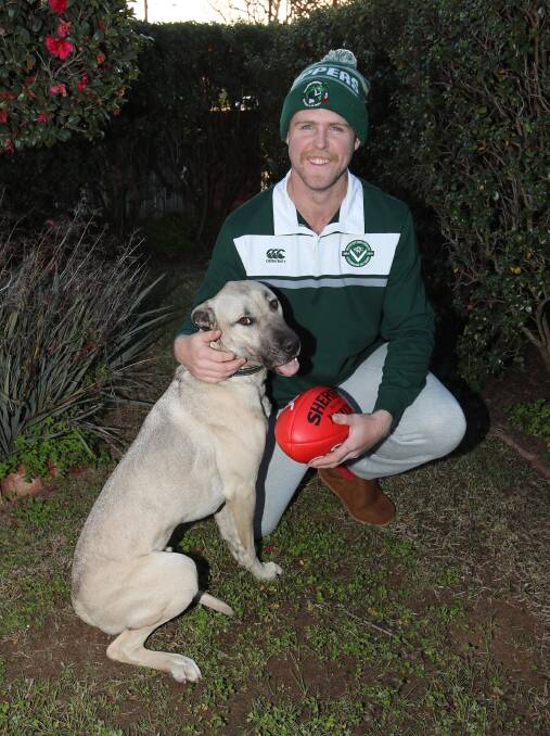 Matt McGowan at home with Bruno on Thursday. Picture: Les Smith