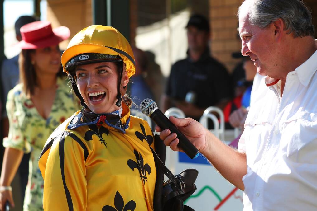 ALL SMILES: Winning jockey Kayla Nisbet is interviewed by Chris Scholtz after winning Friday's Snake Gully Cup on My Maher. Picture: Emma Hillier