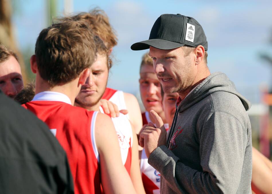 Collingullie-Glenfield Park coach Luke Gestier talks to his players at quarter time on Saturday. Gestier missed the game with a hamstring strain. Picture: Les Smith