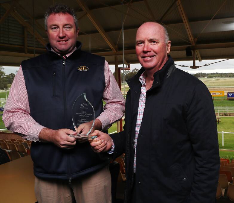 WINNERS: Murrumbidgee Turf Club chief executive Steve Keene and president Stuart Lamont show off the Country TAB Race Club of the Year award. Picture: Emma Hillier