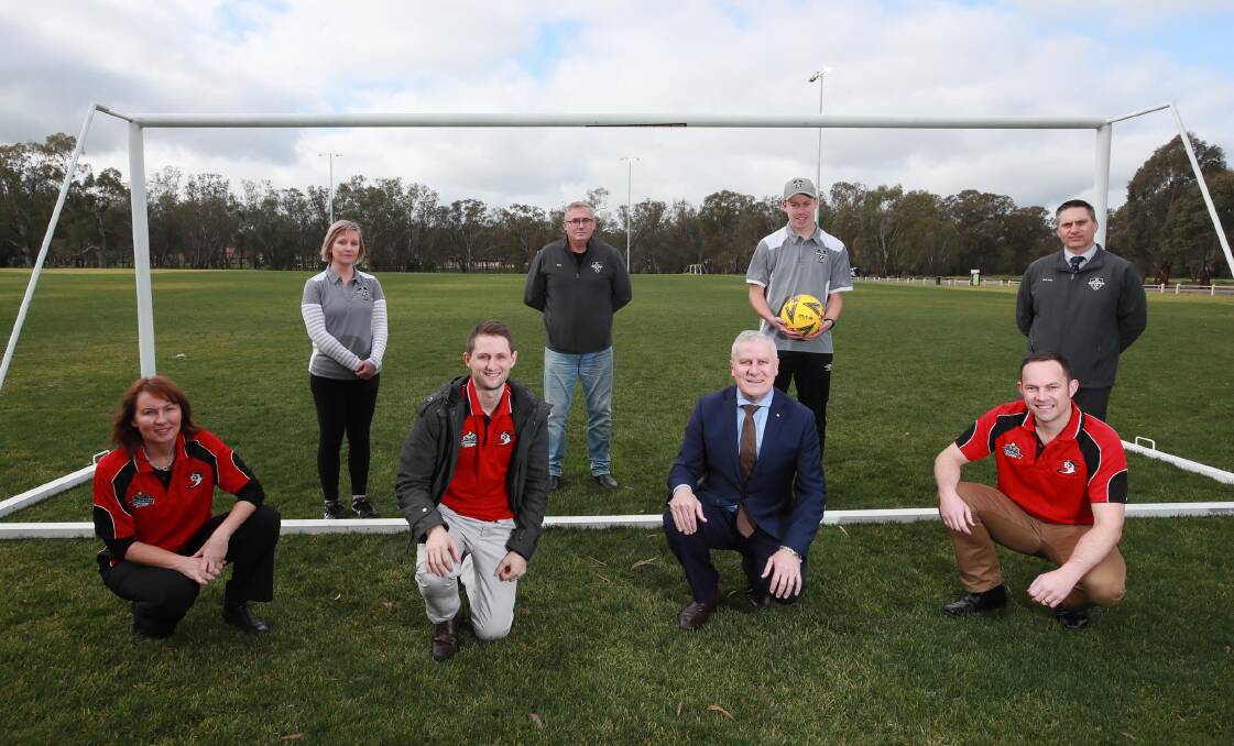 Members of Football Wagga and Lake Albert join Michael McCormack in celebrating the completion of the lighting upgrade at Rawlings Park on Friday. Picture: Les Smith