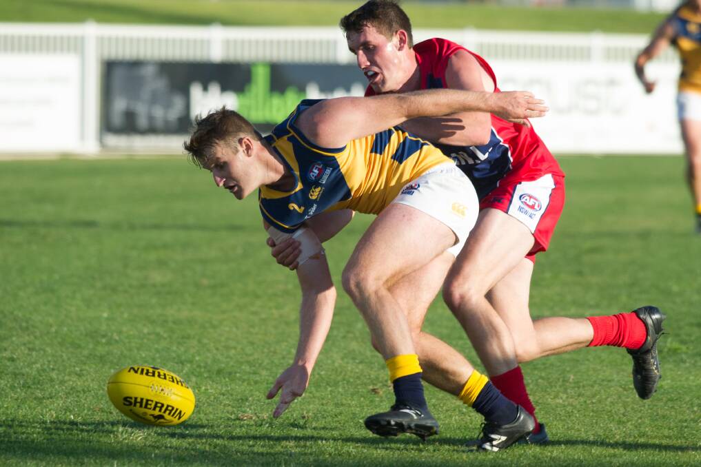 REMATCH: AFL Canberra's Brett Fruend competes with Riverina League's Tom Meline
in the rep clash at Robertson Oval in 2017.