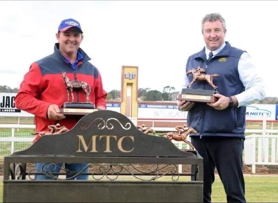 CLEANED UP: Wagga trainer Trevor Sutherland accepts trophies from Murrumbidgee Turf Club chief executive Steve Keene last Sunday.