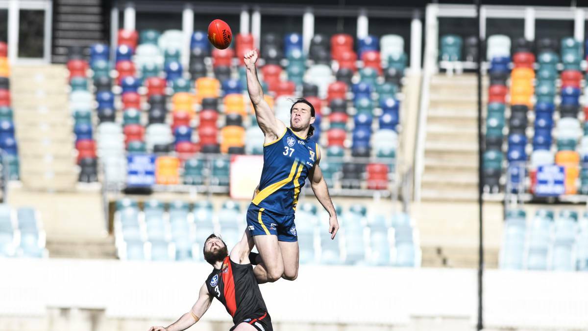 Riley Budd flies high for Canberra Demons. Picture: The Canberra Times