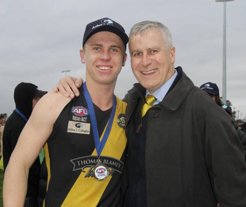 Michael McCormack with son Nick after he won the 2016 Riverina League grand final with Wagga Tigers.