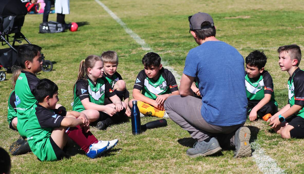FUTURE: South Wagga's under nine team listen to their coach during a game last season. Picture: Emma Hillier