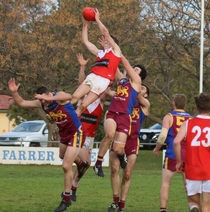 UP THERE, PERRYMAN: Collingullie-Glenfield Park teenager Ed Perryman takes a huge mark against Ganmain-Grong Grong-Matong at Ganmain Sportsground on Sunday. Picture: Cathie Fox
