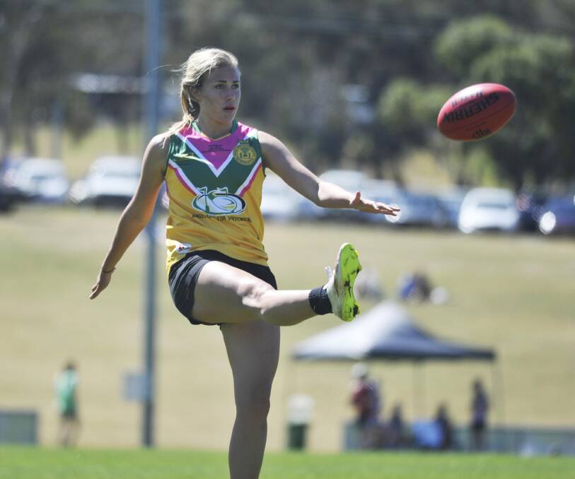 EXCITING OPPORTUNITY: Emily Newton gets a kick away in a charity game at Peter Hastie Oval in 2018. Opportunities for female talent have come a long way since. 