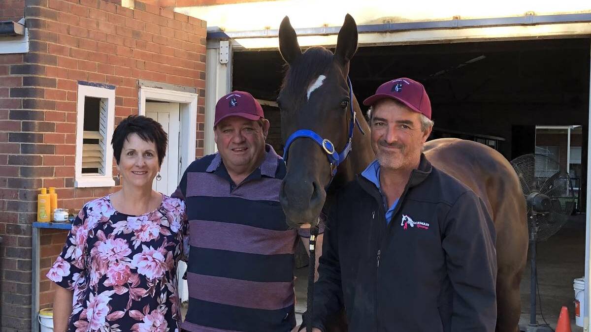 TOUGH CALL: Maria and Noel Penfold and trainer Scott Spackman (right) with Rocket Tiger. They have sent the horse for a good spell. Picture: Peter Doherty