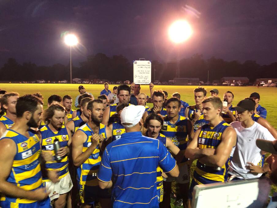 FIRST OUTING: Mangoplah-Cookardinia United-Eastlakes coach Jeremy Rowe talks to the Goannas during their trial against North Wagga at Mangoplah Sportsground on Friday night.