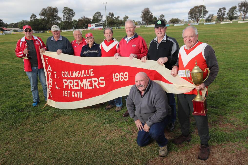 HAPPY DAYS: Ken Morrow, Len Jenkins, Steve Shipway, Brownie Whyte, Barry Chaplin, Kevin Somerville, Peter Jenkins and Russ Meyer, with Scott Menz, who was the four-year-old mascot at the time, prepare for Saturday's 1969 premiership reunion. Picture: Les Smith