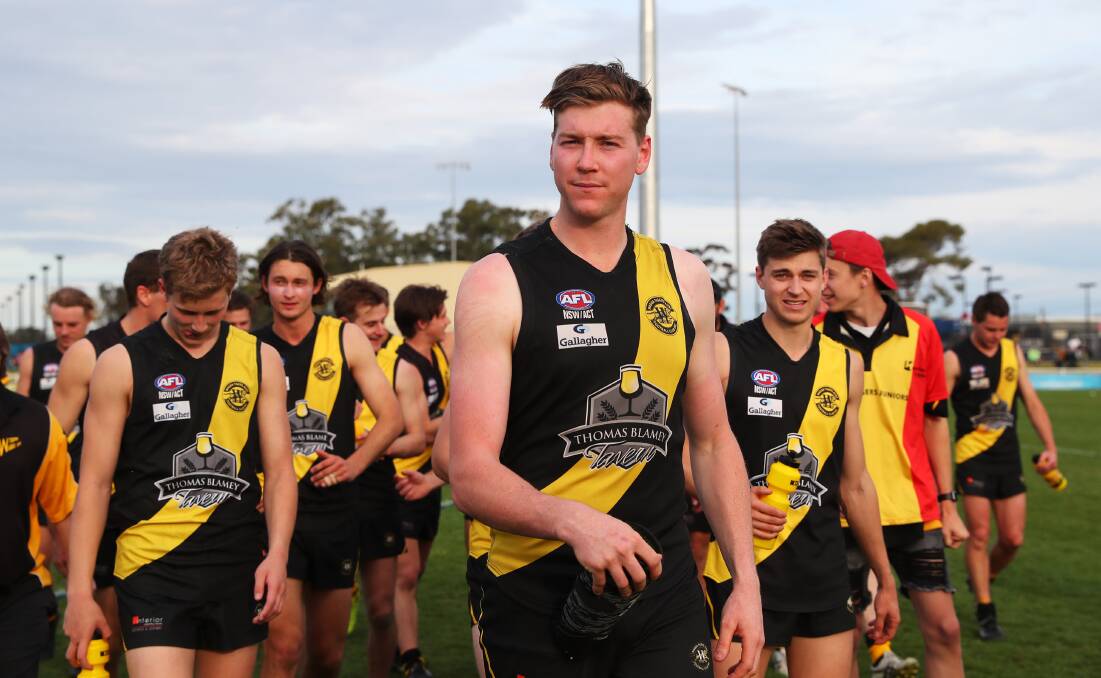 GOOD TO GO: Wagga Tigers ruckman Tom Osmotherly (middle) comes from the field after Sunday's preliminary final. He will play in the grand final despite re-injuring his shoulder. Picture: Emma Hillier