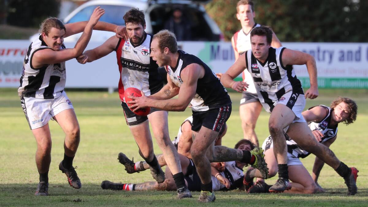 ON THE MOVE: North Wagga's Lachie Highfield gets away from his The Rock-Yerong Creek opponents on Saturday. Picture: Les Smith