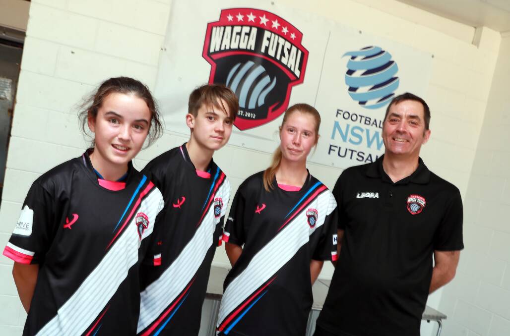 SELECTED: Wagga Futsal president Sam Gray (right) with head coach Sam Gray with Elena Franklin, 12, Caelan Gray, 15, and Zoe Jenkins, 15, who have all been selected to represent NSW Country and NSW Country North. Picture: Les Smith