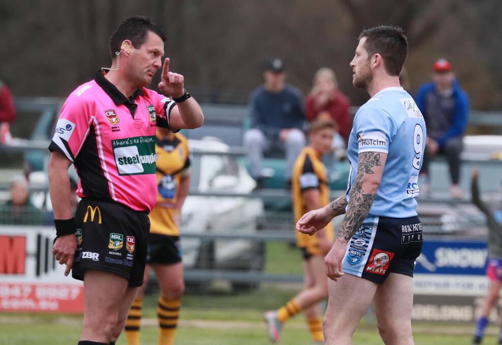 CHARGED: Tumut co-coach Lachlan Bristow receives a lecture from referee Scott Muir in Sunday's major semi-final. Bristow has been charged with striking and faces a two-game suspension. Picture: Les Smith