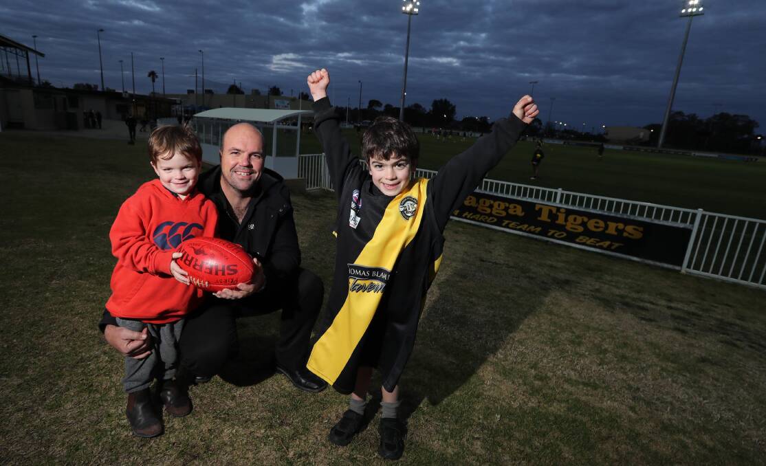 GO DAD: Wagga Tigers' legend Andrew Priest with sons Thomas, 3, and Hamish, 5, at training on Thursday night. Picture: Les Smith