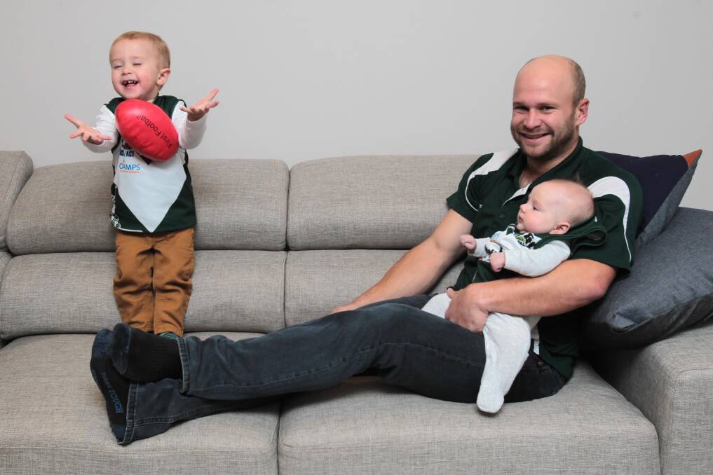 Jamie Maddox at home with sons Harry and Ziek before his 200th game in 2016.