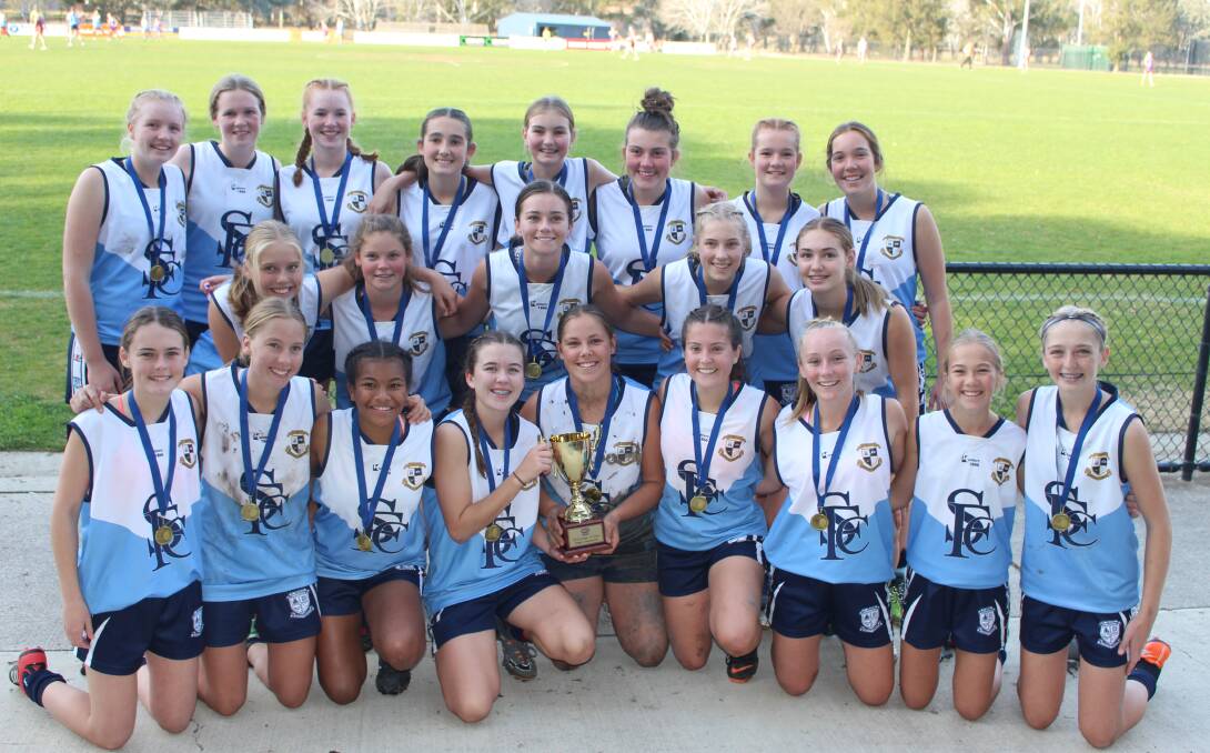 WINNERS: Leeton's St Francis de Sales Regional College celebrate their under 15 state title win in Canberra on Wednesday.