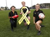 GOOD CAUSE: Transport for NSW's Trish Suckling with Collingullie-Glenfield Park footballer Sam Stening and East Wagga-Kooringal netballer Holly Nelson ahead of Road Safety Round. Picture: Les Smith