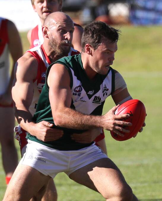 HARD AT IT: Coolamon midfielder Nick Pleming in action against Griffith earlier in the year. The Hoppers take on Narrandera on Saturday. Picture: Les Smith