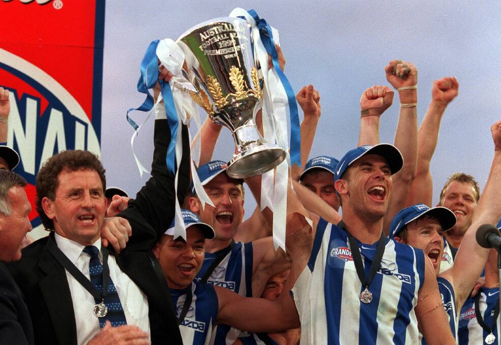 ONE OF THE GREATS: Wagga's Wayne Carey enjoys AFL premiership success with North Melbourne.
