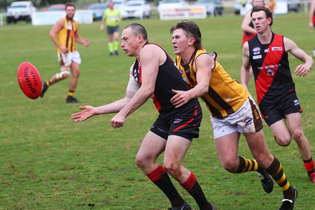 DISAPPOINTED: Farrer League club Marrar is one of the clubs disappointed by AFL Riverina's decision. The Bombers' Chris O'Donnell gets a handball away the last time they met the second-placed East Wagga-Kooringal team at Langtry Oval. Picture: Emma Hillier
