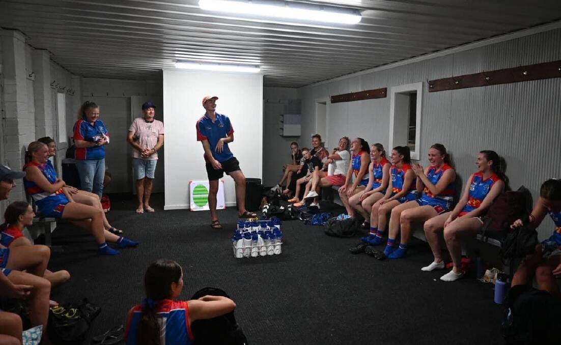 Turvey Park coach Cooper Harmer talks to a very happy Bulldogs playing group after their win at Mangoplah Sportsground on Friday night. Picture by Turvey Park FNC