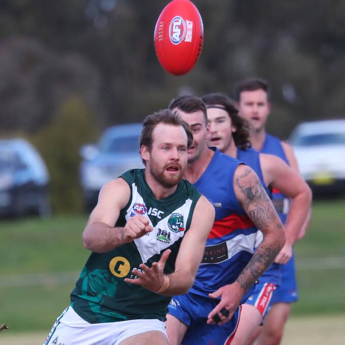 HUNGRY FOR FINALS: Coolamon midfielder Max Hillier fires off a handball in a game against Turvey Park at Maher Oval back in July. Picture: Emma Hillier