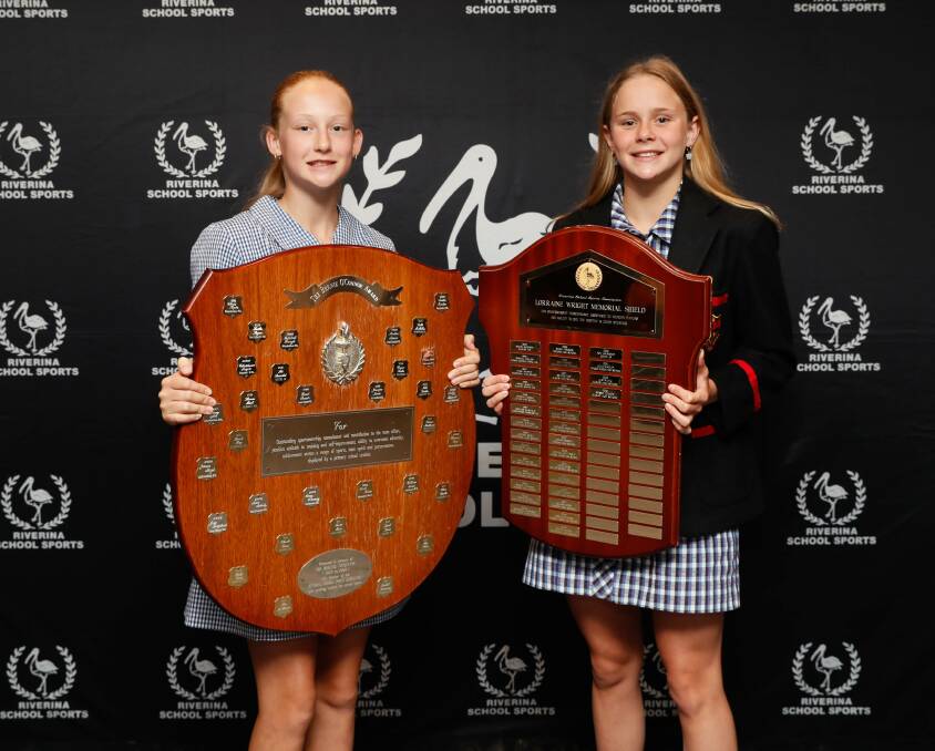 Albury Public School's Isla Geddes and Albury High School's Sienna Toohey show off their respective Bernie O'Connor and Lorraine Wright memorial awards at Riverina School Sports Association's annual blues awards at Wagga RSL Club on Friday. Picture by Les Smith