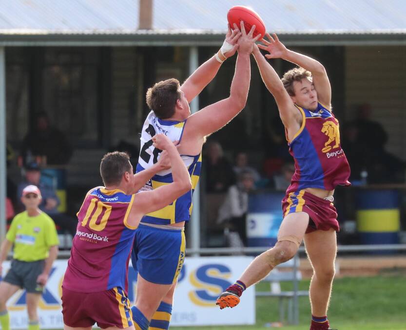 COURAGE: Ganmain-Grong Grong-Matong's Matt Knagge flies in front of Mangoplah-Cookardinia United-Eastlakes' Andrew Dickins on Saturday. Picture: Les Smith