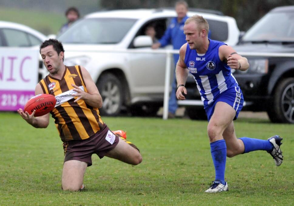 QUALITY MATCH UP: East Wagga-Kooringal full-forward Marc Geppert tries to juggle a mark in front of Temora's Charlie Vallance back in 2014. Picture: Les Smith