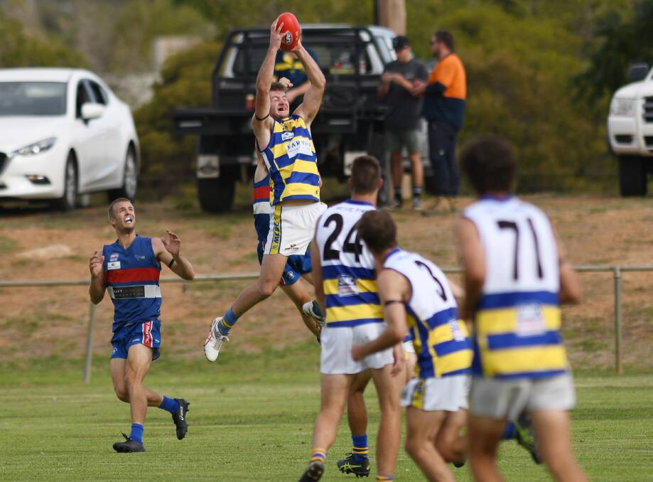 George Kendall takes a strong grab against Turvey Park in round one.