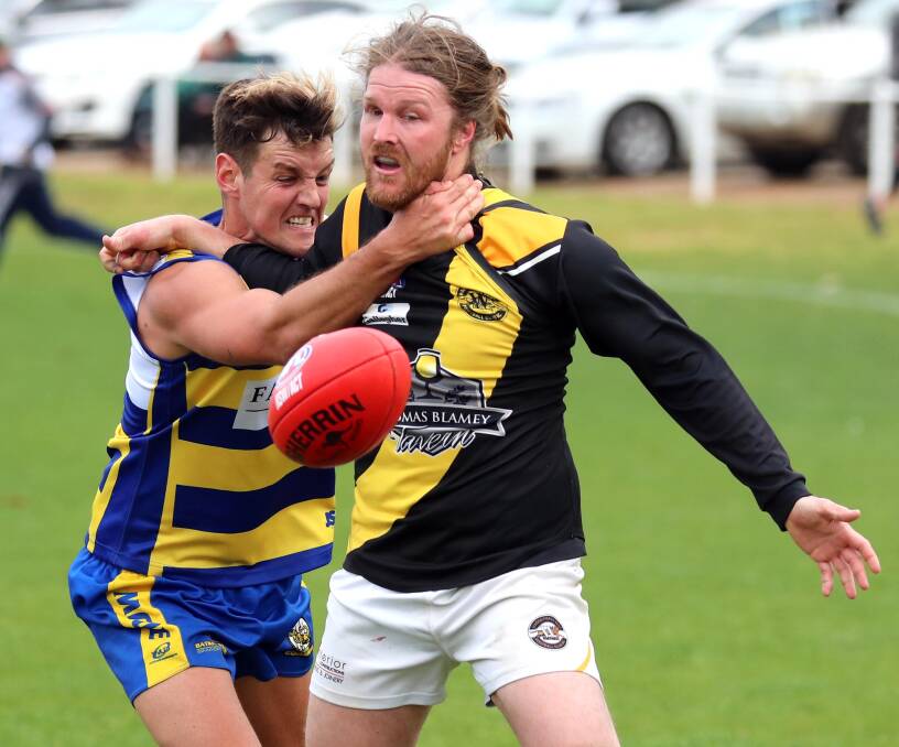 Nick Collins in action for MCUE against Wagga Tigers' Jacob Osbeiston during finals. Picture: Les Smith