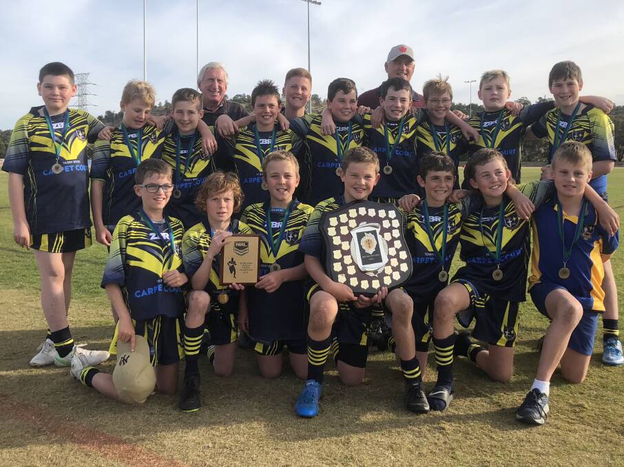 DROUGHT OVER: St Mary's Primary School celebrate their Mortimer Shield success at Parramore Park on Tuesday. Pictures: Matt Malone