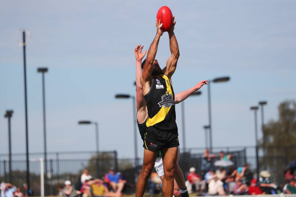 DOMINANT: Wagga Tigers forward Jesse Manton marks on his way to one of his nine goals in Sunday's preliminary final win over Coolamon at Robertson Oval. Picture: Emma Hillier