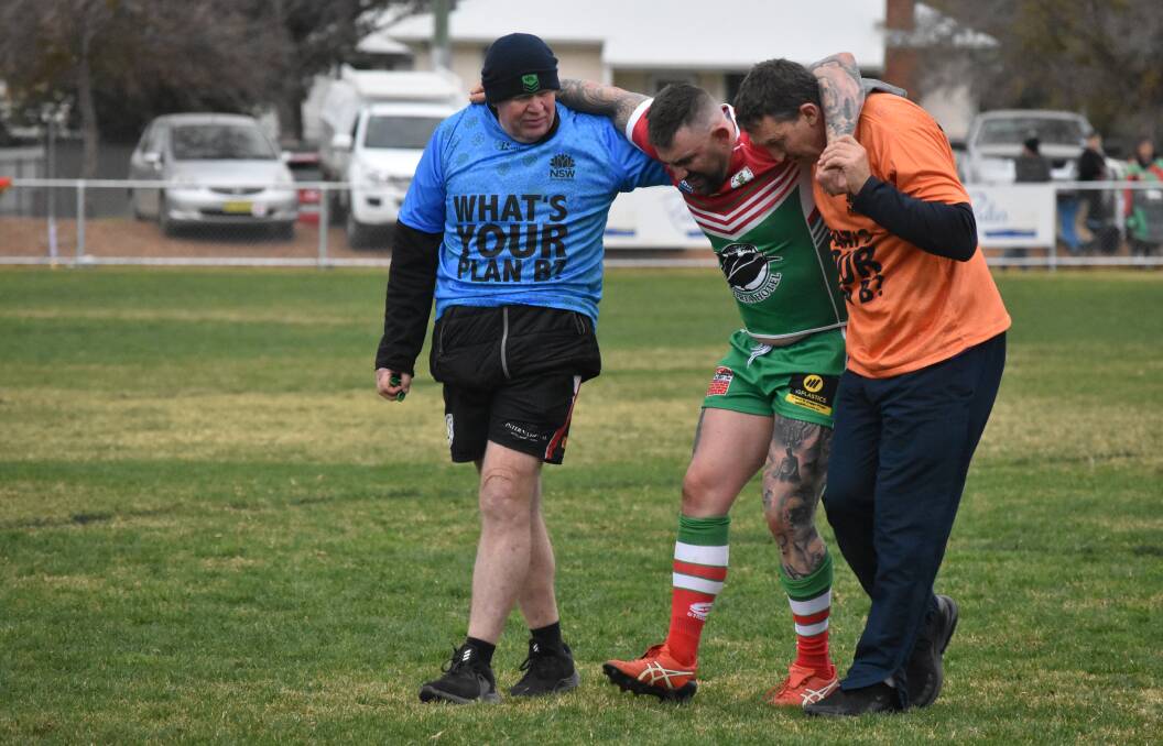TOUGH TIMES: Brothers forward Brayden Sharrock is helped from the field in Brothers' win over Southcity last Saturday. Pictures: Courtney Rees