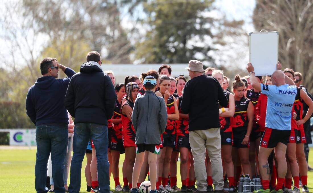 CRUNCH TIME: Riverina Lions coach Jed Lawton talks to his players during Sunday's preliminary final win. Picture: Emma Hillier