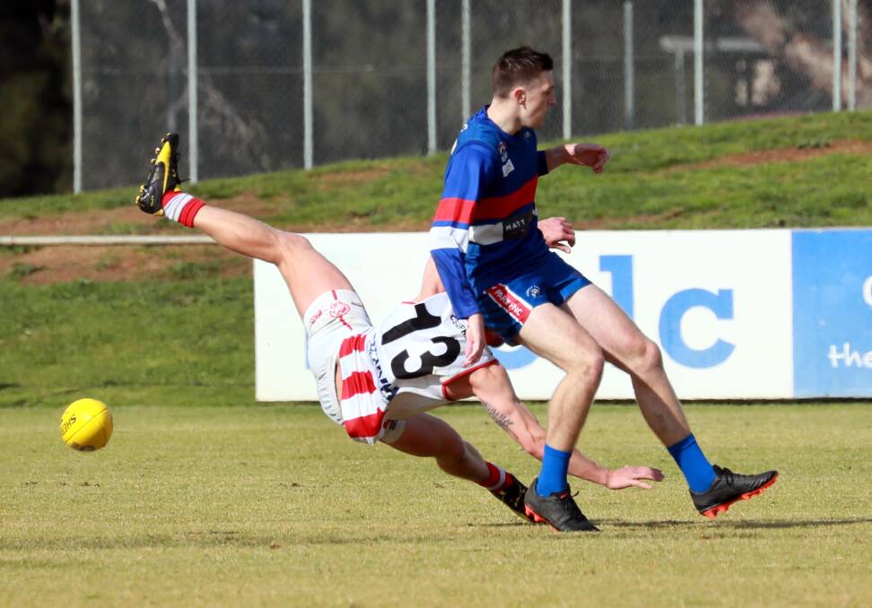 Brad Ashcroft and Max Hanrahan battle it out in the trial game between Turvey Park and Charles Sturt University on Saturday. Picture: Les Smith