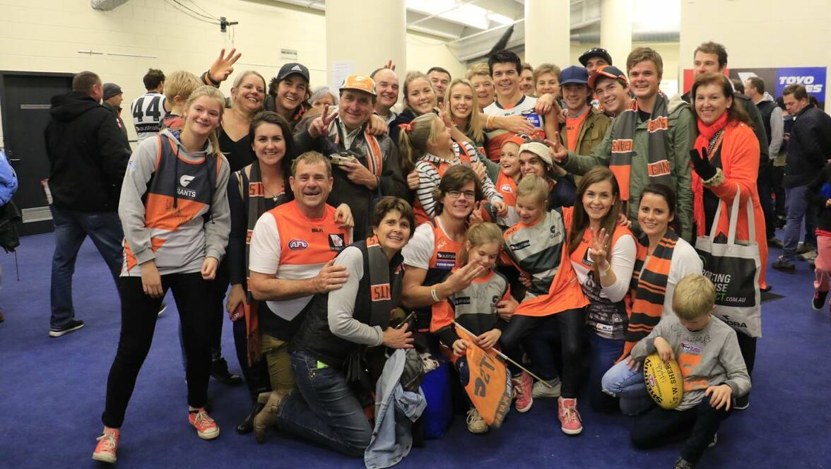 HAPPY FAMILY: The Kennedy clan celebrate Matt's dream AFL debut in the Giants rooms at Etihad Stadium on Sunday. Picture: GWS Giants