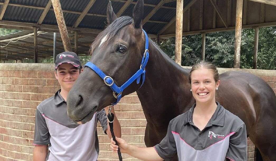 Rocket Tiger with strappers Oliver Spackman and Emily Waters before he returned to racing at Flemington on Saturday. Picture: Jon Tuxworth
