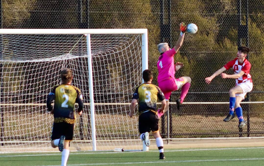 TOP SAVE: Wagga City Wanderers captain Rob Fry in action against O'Connor Knights in Canberra on Sunday. Picture: Leann Rogic