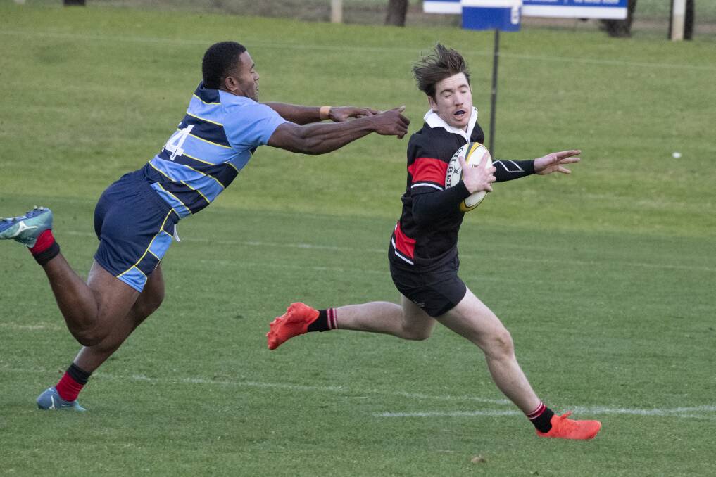 HERO: Lachie Day evades South Coast-Monaro's Vilitati Seru in the Brumbies Provincial Championship at Conolly Rugby Complex on Saturday. Day was the hero for Southern Inland Rugby Union with a match-winning penalty right on full-time. Picture: Madeline Begley