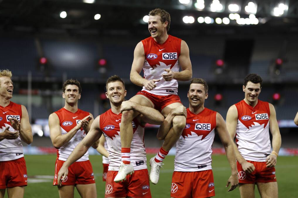 SPECIAL MOMENT: Harry Cunningham is chaired off the ground after his 150th AFL game for Sydney on Saturday night. Picture: Getty Images