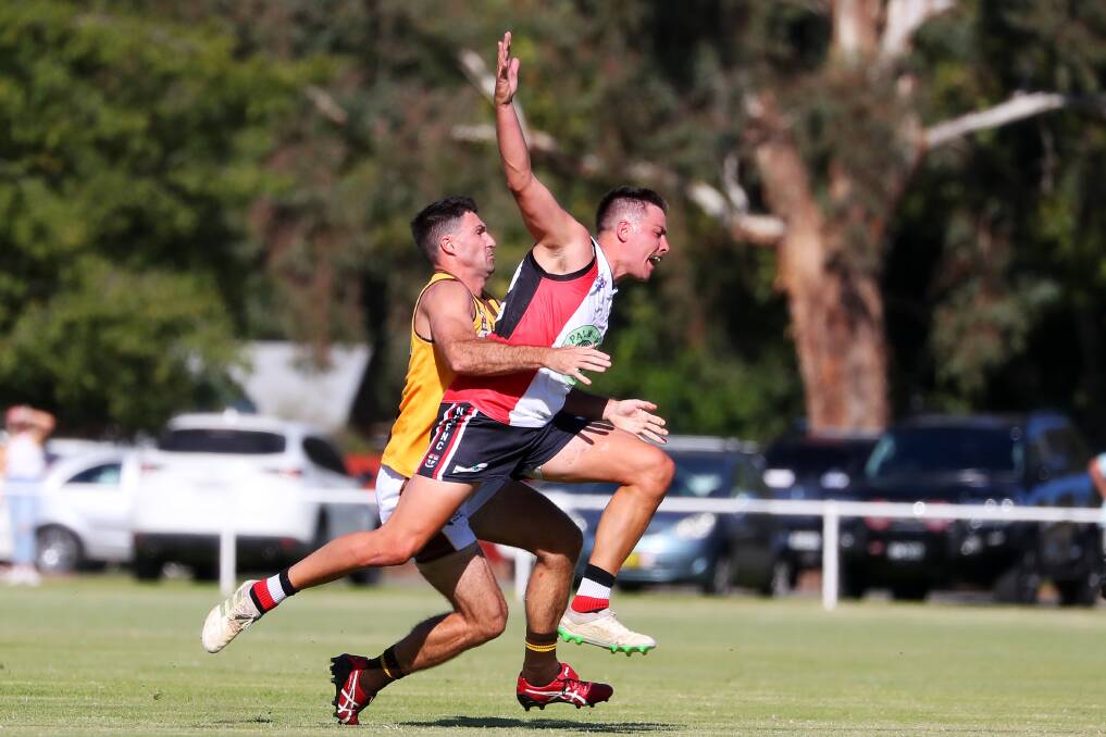 ON HOLD: Experienced Farrer League finals campaigners, East Wagga-Kooringal's Ben Absolum and North Wagga's Ben Alexander, battle it out earlier in the year. Picture: Emma Hillier