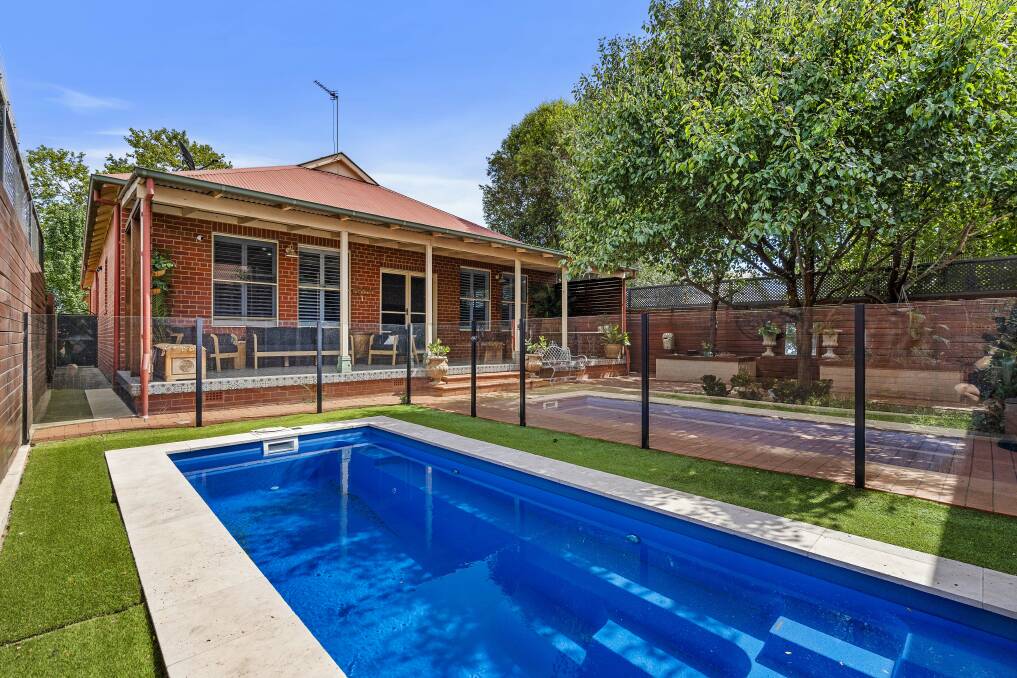 Venture out the back to discover a covered entertaining space, perfect for alfresco dining, while overlooking the low-maintenance garden and the shimmering inground pool. Pictures supplied.