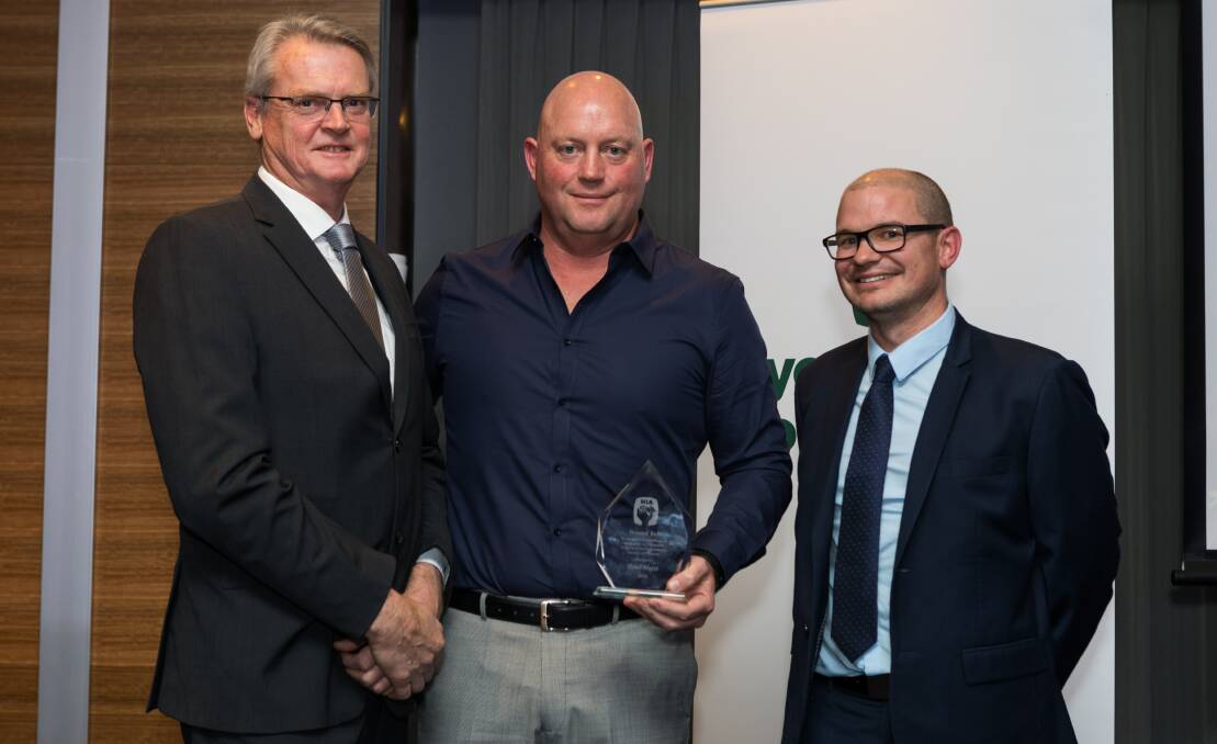 RECOGNITION: Peter Hurst (centre) is congratulated on being added to the HIA Honour Roll by 2017 inductee Tony Balding (left) and HIA Wagga chairman Glenn Sewell.