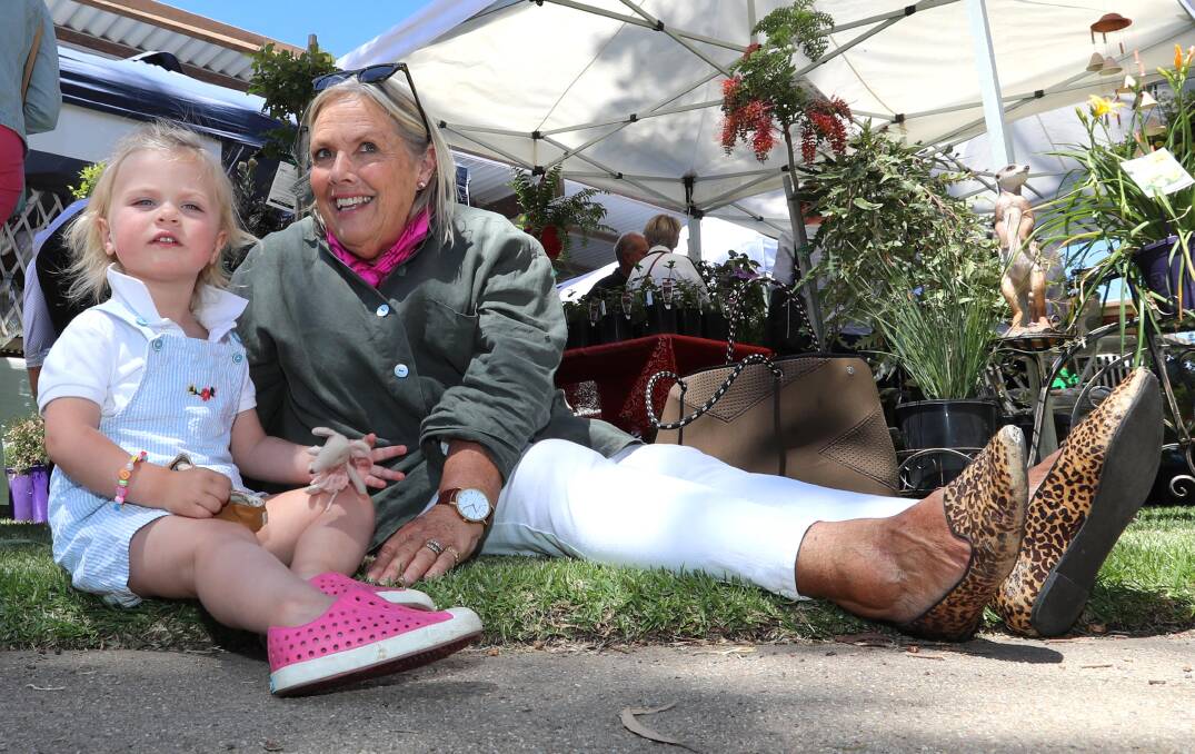 FAMILY TIME: Isabelle Cullenward of Wagga and her nan Annie Boyd from Young enjoy a brief respite from shopping at the 2018 CMRI Christmas Fair.